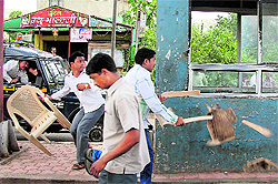 MNS activists vandalise a toll plaza during a protest in Patan on Thursday