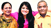 Nayan with her parents