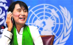 Myanmar opposition leader Aung San Suu Kyi gestures during the 101th International Labour Organisation Conference in Geneva on Thursday