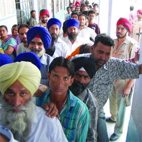 Poll call Residents wait to cast their vote during a re-poll in a booth at Ward 3 in Amritsar on Friday