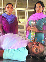 Ganpati Devi lies on a trolley