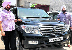 Jagjit Singh Chahal (left) poses with his vehicle
