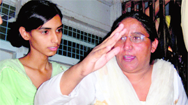 Jaswanti Devi, the main accused in the infamous Apna Ghar case, is produced in a Rohtak court on Friday.