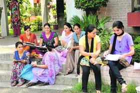 Girl students file their admission forms at Government College for Women, Gandhi Nagar in Jammu on Friday