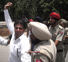Protesters in action against the traffic police near the Rose Garden in Bathinda on Saturday.