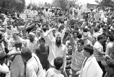 Farmers of 20 villages block the Ambala-Hissar highway, on Saturday. 