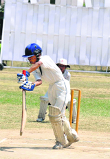A player in action during the cricket camp at Hostel Ground in Jammu on Saturday.