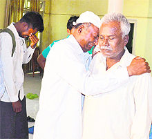 A teary-eyed Bhanu Das embraces a family member in Amritsar on Sunday