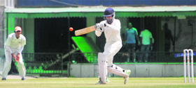 A player prepares to pull the ball during a match between Chandigarh and Amritsar at PCA Stadium in Mohali.