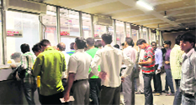 A view of ticket-seekers at the railway reservation counter of the Inter-State Bus Terminus at Sector 17 in Chandigarh on Sunday.