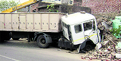 The truck trolley that banged into a building on the Ludhiana-Malerkotla road at Dehlon