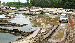Muddy caravan: SUVs participate in an off-roading rally , organised by the Tata group, on the outskirts of Ludhiana on Sunday