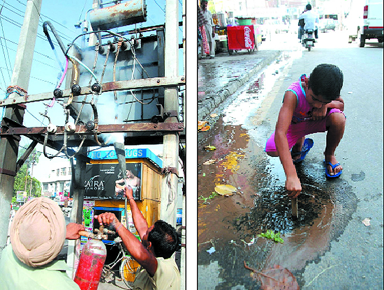  Electricity department employees try to douse the fire that broke out in a transformer near the Fire Brigade Chowk on Monday. The transformer caught fire due to overheating caused by the increased summer load; A boy (right) tries to plug the leakage in a water pipe near the Shaheed Bhagat Singh Chowk. The water pipe was damaged when a tent was pitched in the area without taking into account the damage it would cause. 