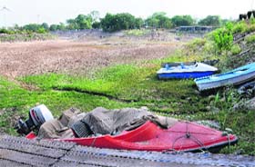 Motorboats kept at the dry bed of the Sukhna Lake in Chandigarh on Monday
