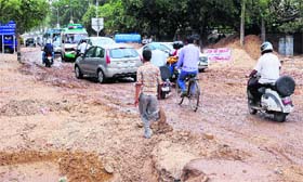 An unmetalled road at the airport traffic lights after some underground pipeilne work in Chandigarh on Monday