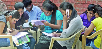 Students fill in forms at Miranda House. 