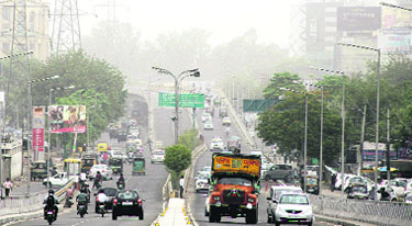 A dust storm engulfs the city in the morning in Jalandhar on Monday. 