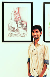 Jaywant Katrojwar poses with his creation at Artmosphere Gallery in Ludhiana.