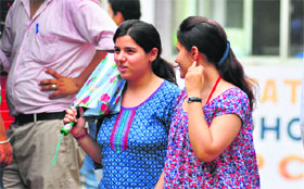 Girls come out of the examination hall after appearing in the CET conducted by PAU, Ludhiana. 