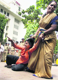  The police arrests a student activist participating in a protest outside the Mantralaya in Mumbai on Monday. 