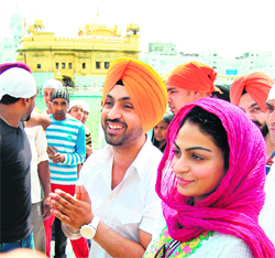 Diljit Dosanjh and Neeru Bajwa pay obeisance at the Golden Temple in Amritsar on Tuesday.
