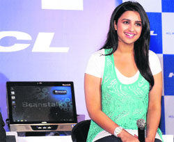 Bollywood actress Parineeti Chopra poses with Beanstalk all-in-one PC of HCL at its launch in New Delhi on Tuesday. The PCs are priced between 