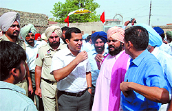 Deputy Commissioner of Bathinda, Kamal Kishore Yadav, interacts with locals