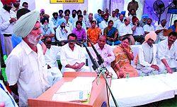 Jarnail Singh, who will be seen in Aamir Khans show Satyamev Jayate on June 24, makes a point during a public hearing before the standing Parliamentary Committee in village Jajjal. 