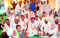 Congress workers outside the District Administrative Complex in Bathinda on Tuesday, the second day of their dharna against alleged police inaction