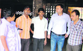 Officials of the Administration with two boys who were found working at a dhaba in Ropar. 