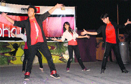 Students of Chitkara University present a dance performance during the farewell party.