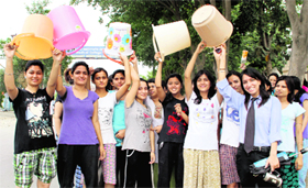 Students of SGRR Medical College stage a protest against inadequate water supply to their hostels in Dehradun on Tuesday.