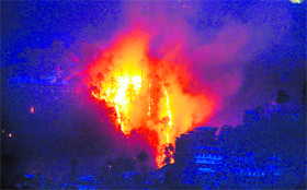 Rise in mercury triggers fire in a pine forest near Sankat Mochan in Shimla.