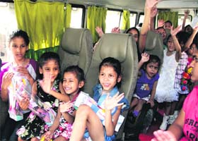 The inmates of Unique Home on their way to a water amusement park near Jalandhar on Tuesday