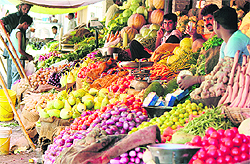 Vegetable Vendors wait for customers in Nai Basti area of Jammu on Tuesday