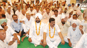 Congress leaders squat outside the District Administrative Complex in Bathinda on Wednesday. The leaders have threatened to resume their stir if the accused are not identified by the police. 