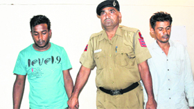 The accused in police custody.