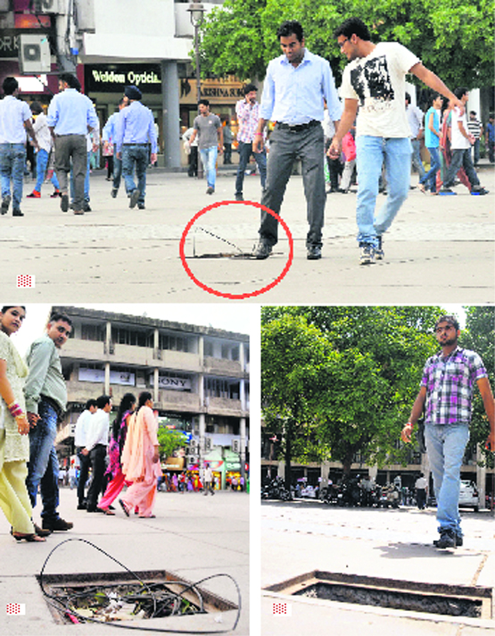 A youth’s foot gets stuck in a drainage hole near the DC’s office at Sector 17 in Chandigarh. Open drainage holes are a common sight in the sector. Nothing concrete has been done to get these covered so far.
