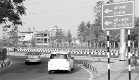 Vehicles move towards the highway from the link road separating Sectors 11 and 14 in Panchkula on Wednesday.