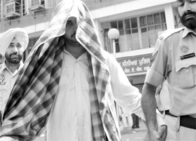 The accused in police custody in Mohali on Wednesday.