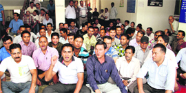 Employees of the Education Directorate stage a dharna in Dehradun on Wednesday.