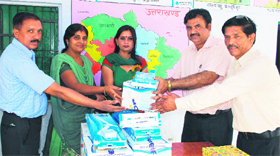 Officials of the State Bank of India donate fans to Government Primary School at Mokhampur near Dehradun on Wednesday.
