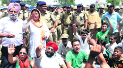 Protesters stage a dharna against an anti-encroachment drive by the Dehradun administration in Dehradun on Wednesday.