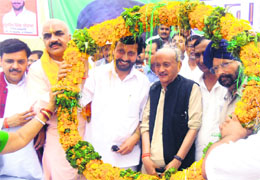 BJP candidate from Sitarganj Prakash Pant along with former Chief Minister Bhagat Singh Koshiyari at a party rally at Sitarganj on Wednesday.