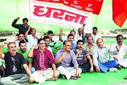 Employees of Ordnance Factory staging a protest in support of their demands in Dehradun on Wednesday.