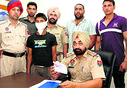 Migrant labourer Samru in the police net in Jalandhar on Wednesday