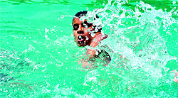 An aspirant gives his best shot during the swimming trials at the MC swimming pool in Ludhiana on Wednesday