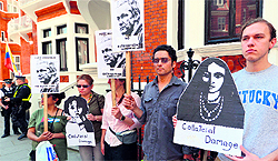 Supporters of Wikileaks founder Julian Assange rally with placards outside the Ecuador Embassy in London