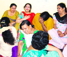 An inconsolable mother of the victim, Komal (in red dupatta), and relatives in Amritsar. 
