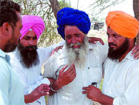Relatives (above and below) of the victims of the car-train accident grieve uncontrollably